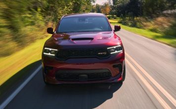 Dodge Durango Hellcat Red Fury Edition Lands in Mexico at $2.17 Million Pesos, 55 Units Only Red Dodge Durango Hellcat driving on a tree-lined highway, front view with motion blur showing performance capability.