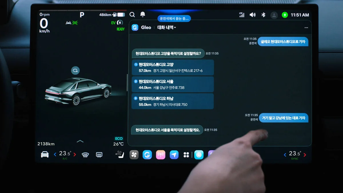 Hyundai vehicle infotainment touchscreen displaying Pleos Connect navigation interface with Korean language chat-based direc…