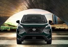 Nissan Becomes Fastest-Growing Mainstream Brand in U.S. After 12 Straight Months of Retail Gains Dark green Nissan SUV photographed head-on beneath modern curved architecture, showcasing the vehicle's distinctive grille a…