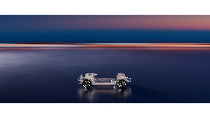 Stellantis STLA One 2027 platform concept displayed in profile against twilight sky and water backdrop