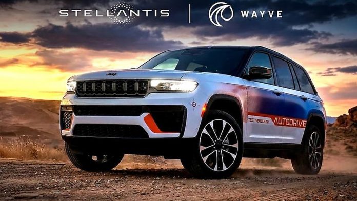 Jeep Grand Cherokee 5 concept vehicle with Stellantis and Wayve branding on desert terrain at sunset, showcasing autonomous…